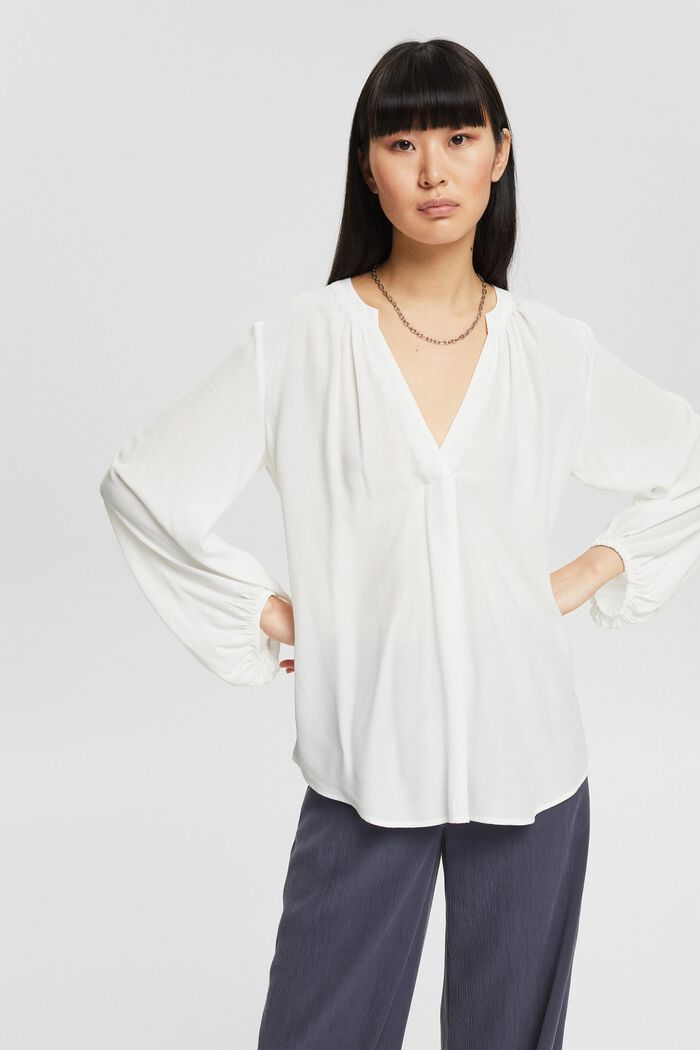 Blouse with a cup-shaped neckline